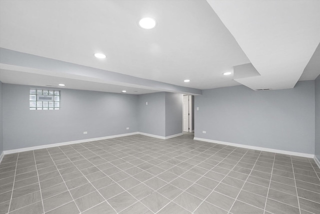 basement with recessed lighting and tile patterned flooring