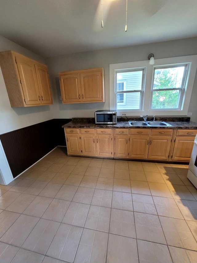 521 Forsythe Ave, Calumet City, IL 60409 - kitchen with light tile patterned floors, a sink, and stainless steel microwave