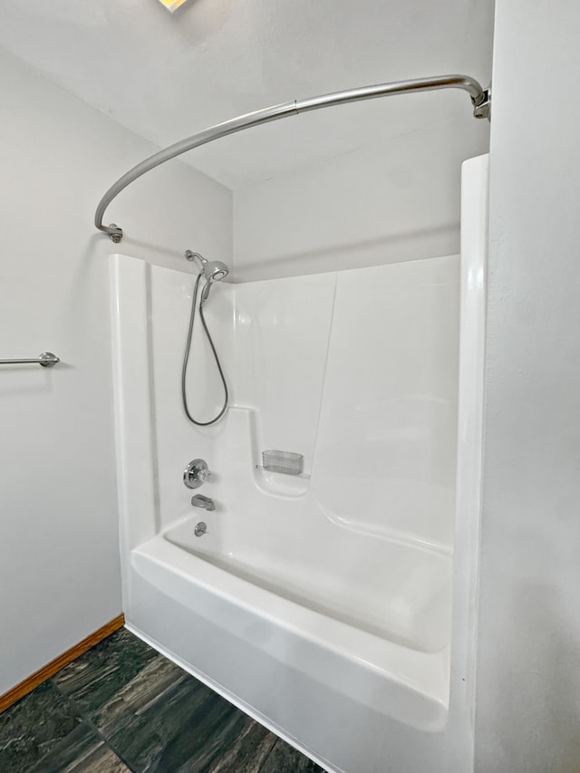 bathroom with shower / bath combination and wood-type flooring