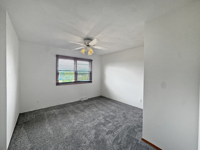 empty room featuring ceiling fan and carpet flooring