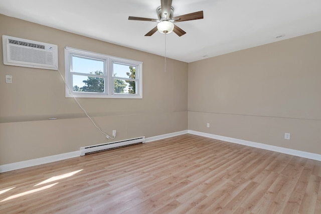 spare room with a baseboard radiator, ceiling fan, light wood-type flooring, and a wall mounted air conditioner