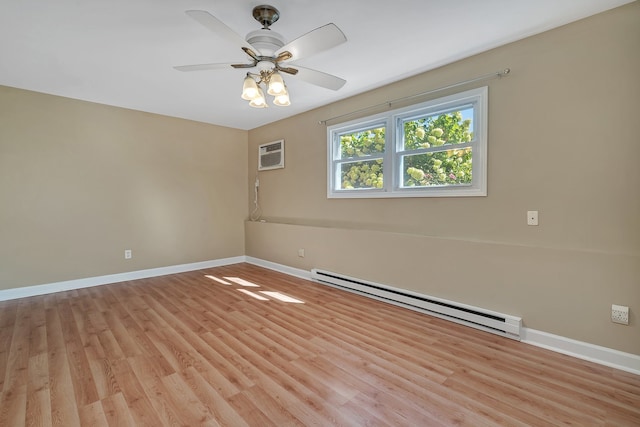 empty room featuring a wall mounted AC, baseboard heating, light wood-type flooring, and ceiling fan