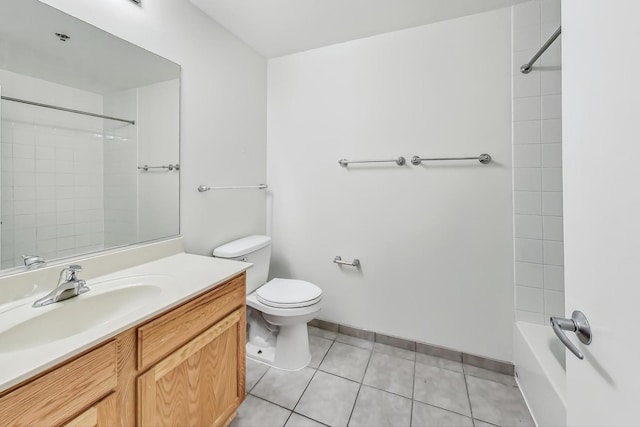 full bathroom featuring tile patterned flooring, vanity, toilet, and tiled shower / bath