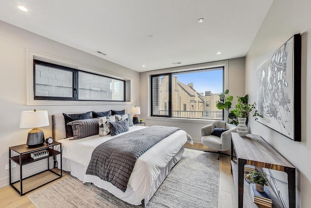 bedroom with light hardwood / wood-style floors