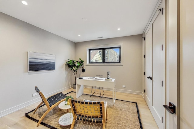 home office featuring light hardwood / wood-style floors