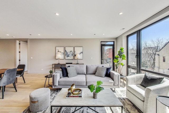 living room with light hardwood / wood-style floors