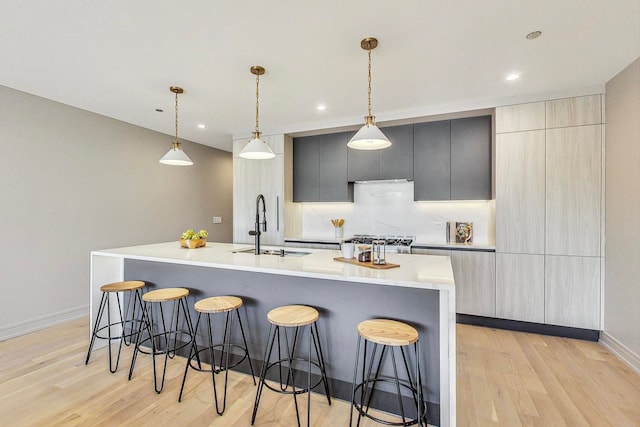 kitchen featuring a spacious island, pendant lighting, and a kitchen breakfast bar