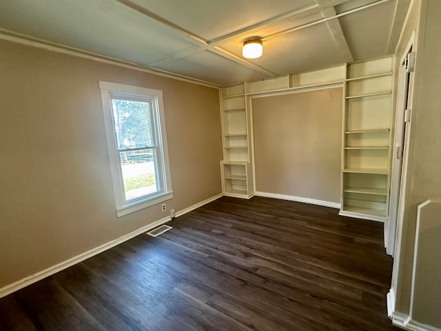 unfurnished bedroom featuring coffered ceiling and dark wood-type flooring