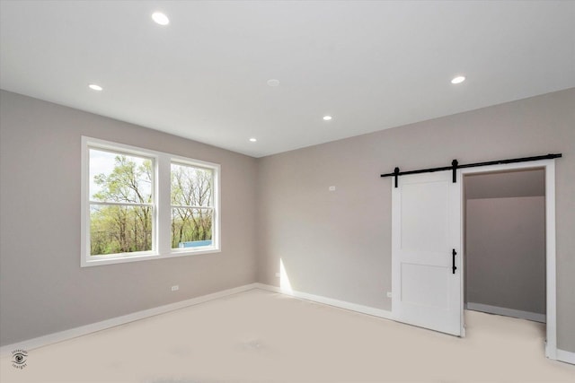 135 W 18th St, Lockport, IL 60441 - unfurnished room with a barn door and recessed lighting