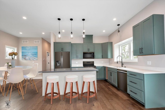 135 W 18th St, Lockport, IL 60441 - kitchen featuring stainless steel appliances, a sink, a kitchen bar, dark wood-type flooring, and recessed lighting