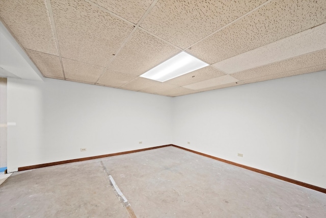 basement featuring a drop ceiling