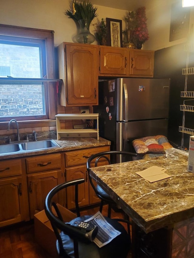 kitchen with stainless steel refrigerator and sink