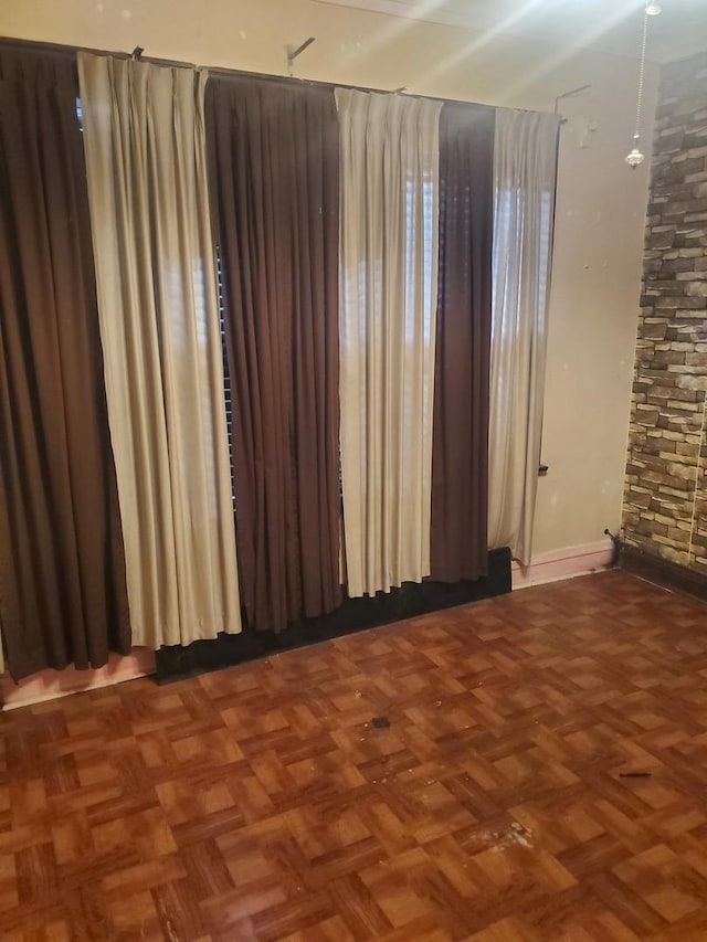 empty room featuring dark parquet floors