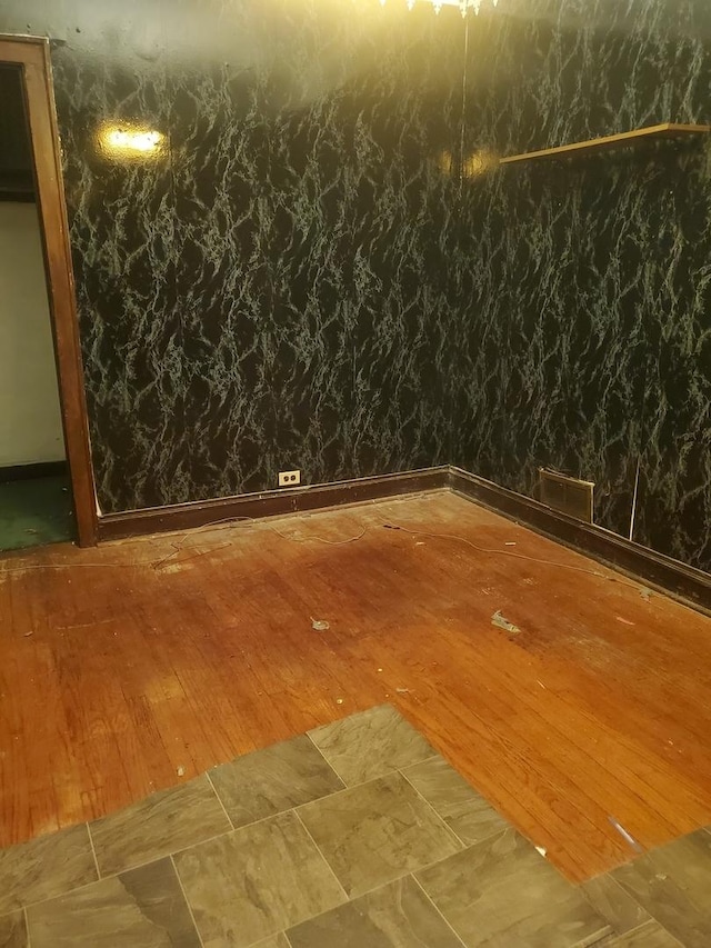 spare room with hardwood / wood-style flooring