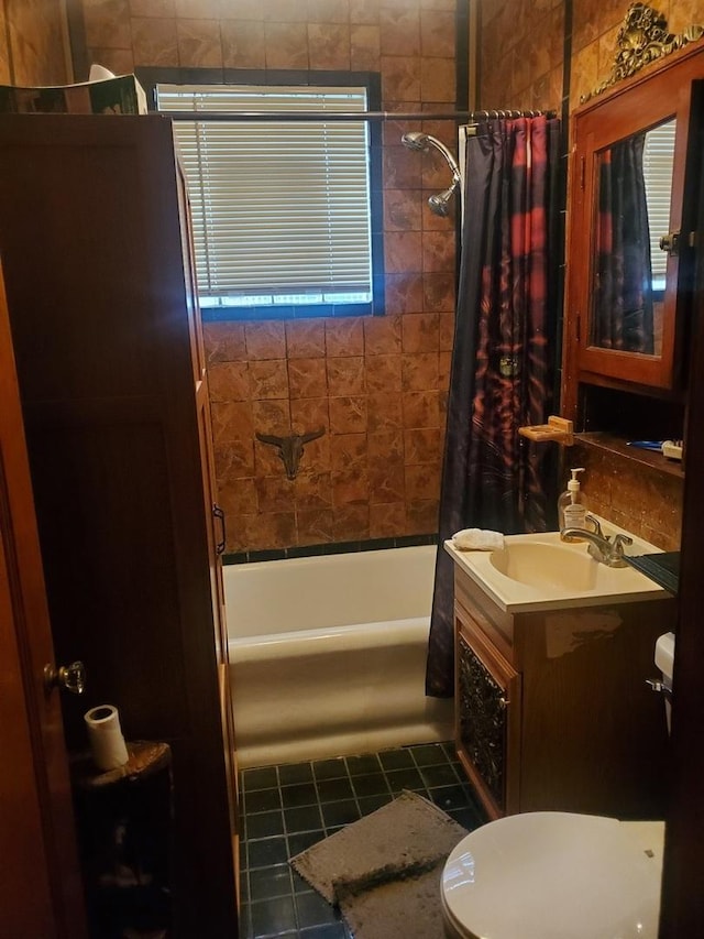 full bathroom with toilet, vanity, tile patterned floors, and shower / bath combo with shower curtain