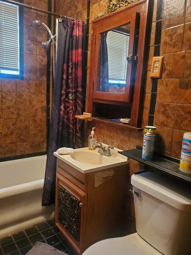 full bathroom with shower / bath combination with curtain, vanity, toilet, and tile patterned floors