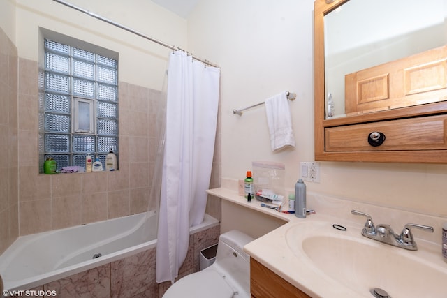 full bathroom with vanity, toilet, and shower / tub combo