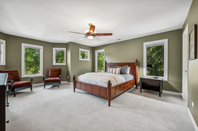 bedroom featuring ceiling fan and light colored carpet