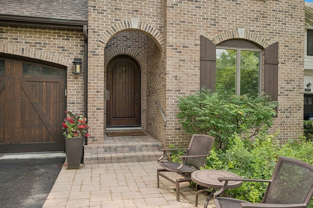 doorway to property featuring a garage