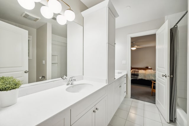 bathroom with shower / bath combination with curtain, tile patterned flooring, ceiling fan, and vanity