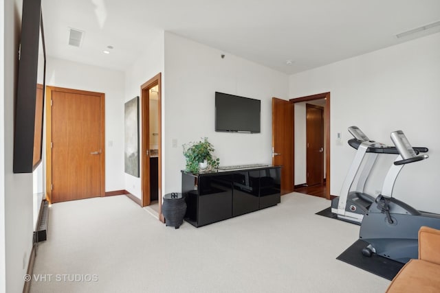 exercise area with carpet flooring and visible vents