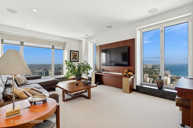 carpeted living area with recessed lighting