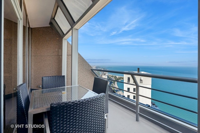 balcony featuring a water view