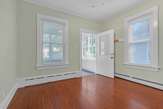 doorway to outside with a healthy amount of sunlight, hardwood / wood-style floors, and a baseboard radiator