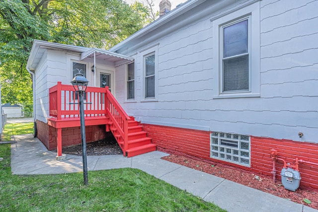 exterior space with a lawn and a deck