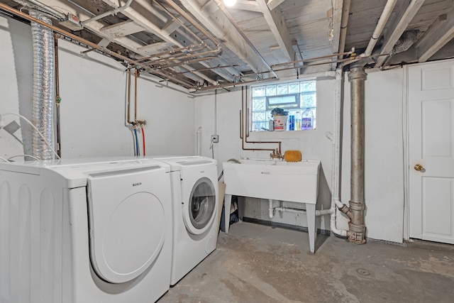 washroom with washing machine and clothes dryer