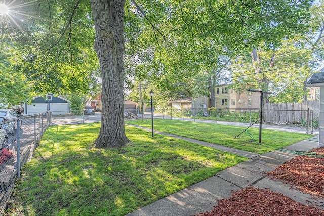 view of yard featuring an outdoor structure and a garage