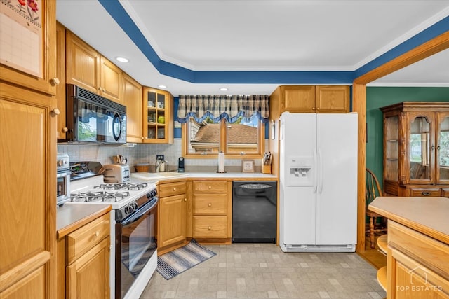 kitchen with crown molding, black appliances, backsplash, and sink