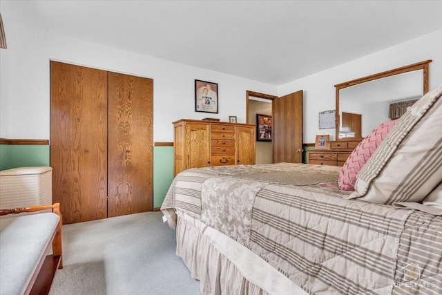 bedroom with carpet floors and a closet