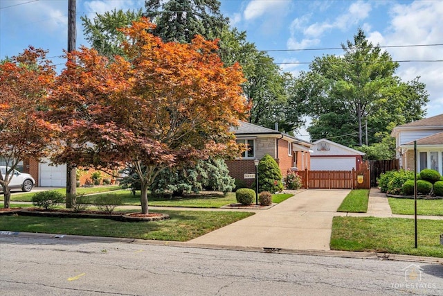 view of property hidden behind natural elements featuring brick siding, a front lawn, and fence