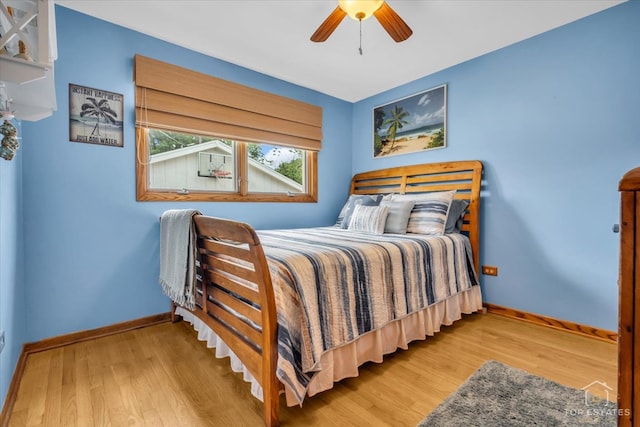 bedroom featuring ceiling fan and light hardwood / wood-style floors