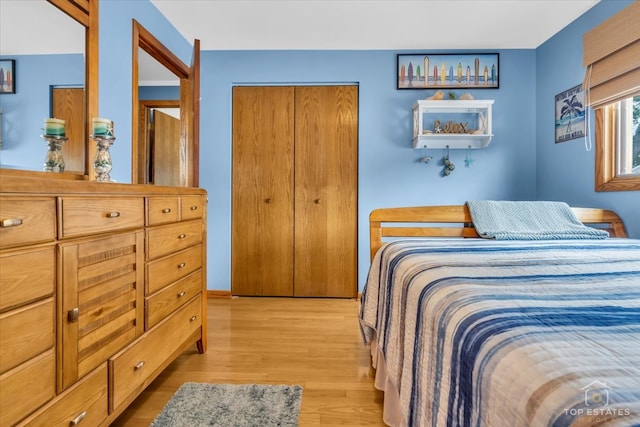 bedroom featuring a closet and light hardwood / wood-style flooring