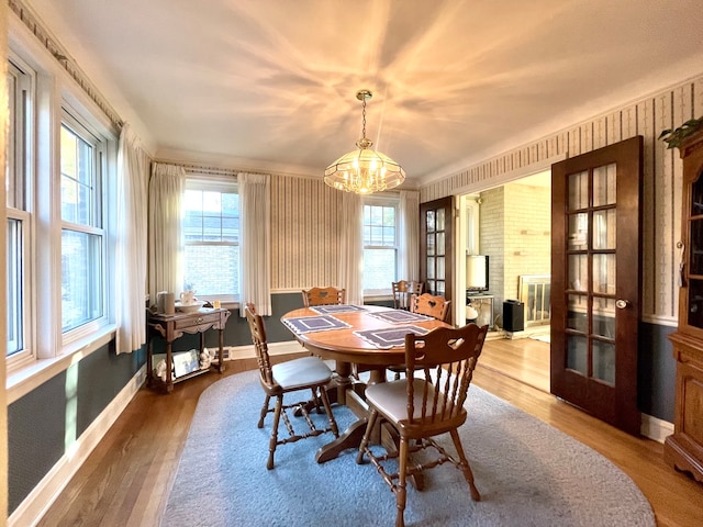 dining room with a notable chandelier and hardwood / wood-style flooring