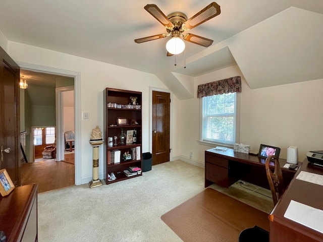 office with light carpet, lofted ceiling, and ceiling fan