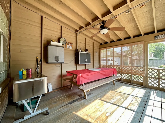 sunroom featuring vaulted ceiling and ceiling fan