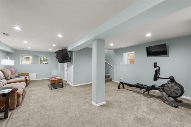 workout area featuring light colored carpet