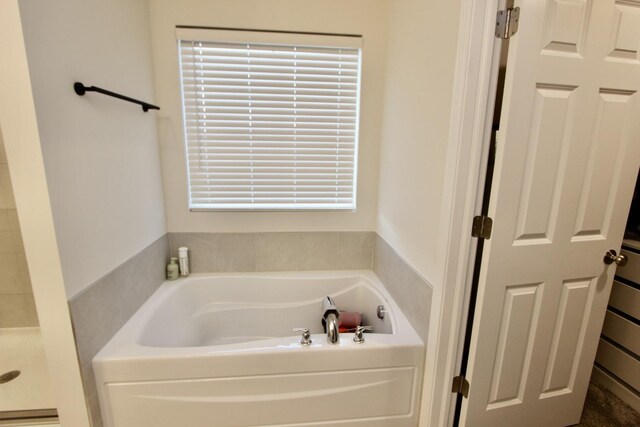 bathroom with a tub