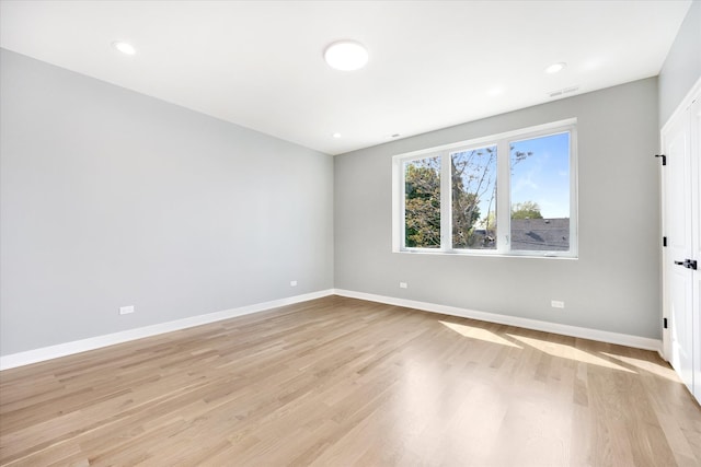 empty room with light wood-type flooring