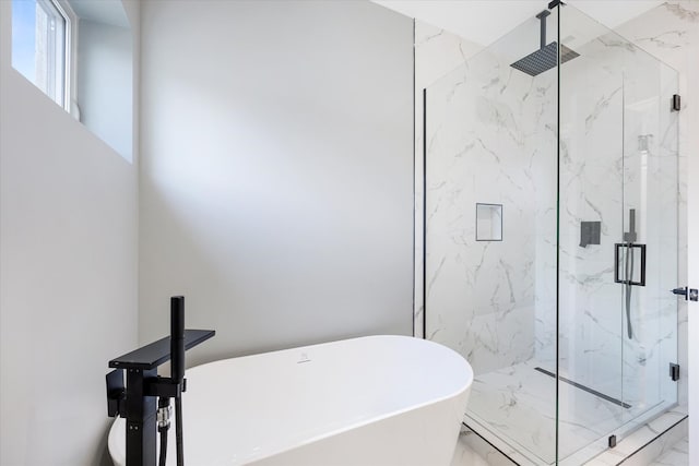 bathroom with shower with separate bathtub