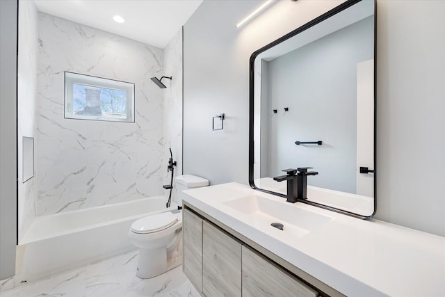 full bathroom featuring toilet, tiled shower / bath combo, and vanity