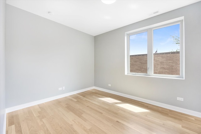 unfurnished room with light hardwood / wood-style floors