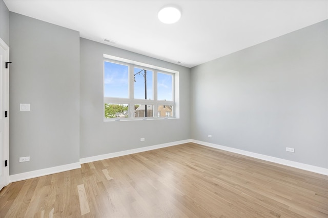 empty room with light hardwood / wood-style floors