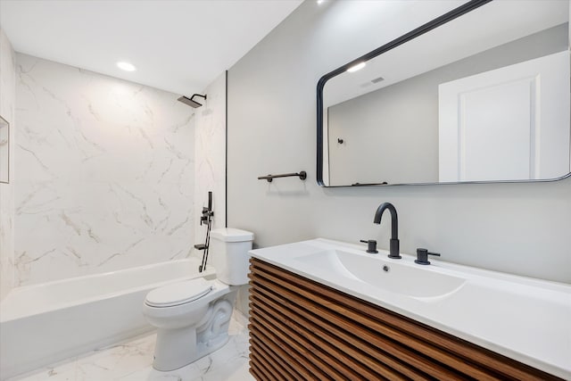 full bathroom with tiled shower / bath, vanity, and toilet