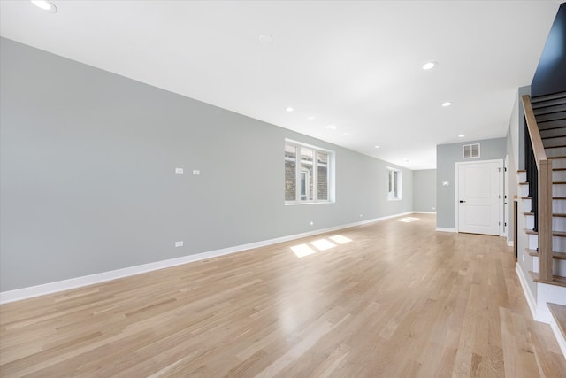 unfurnished living room with light wood-type flooring