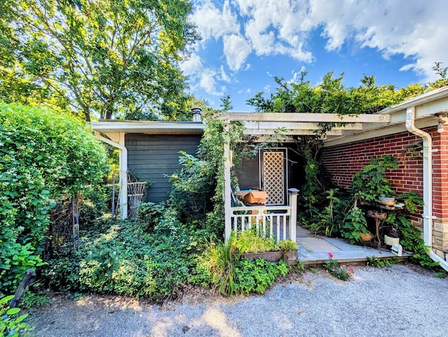 exterior space featuring a patio area and brick siding