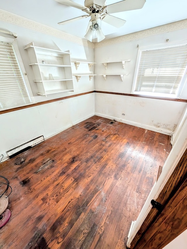 spare room with ceiling fan and hardwood / wood-style flooring